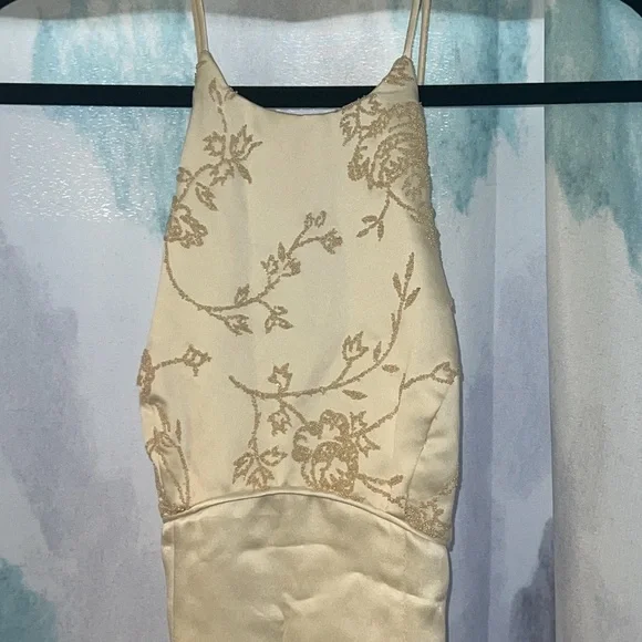 Ivory/cream dress with spaghetti straps and a zipper in the back. Gently used. - Picture 5 of 11